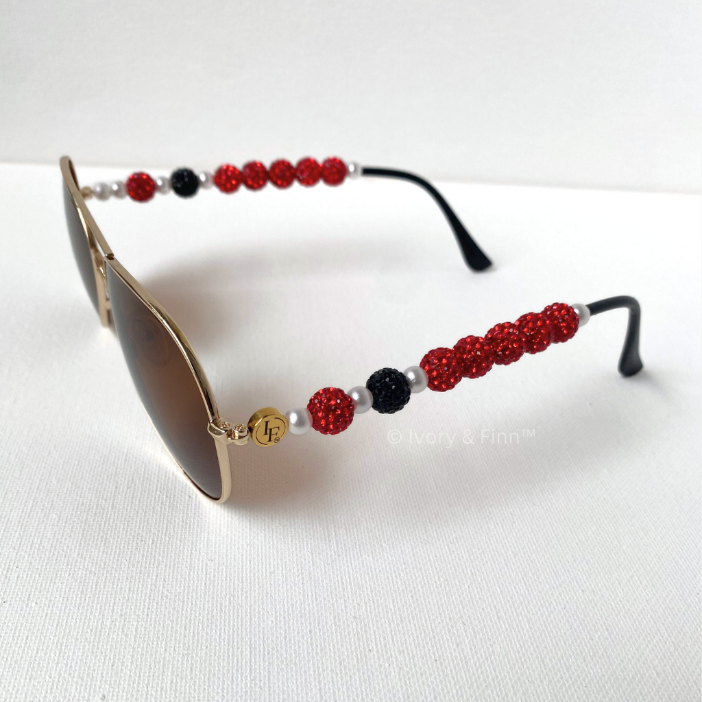 Custom red and black beaded sunglasses with pearl accents by Ivory & Finn™ – Crimson Spark style, jewelry-inspired eyewear