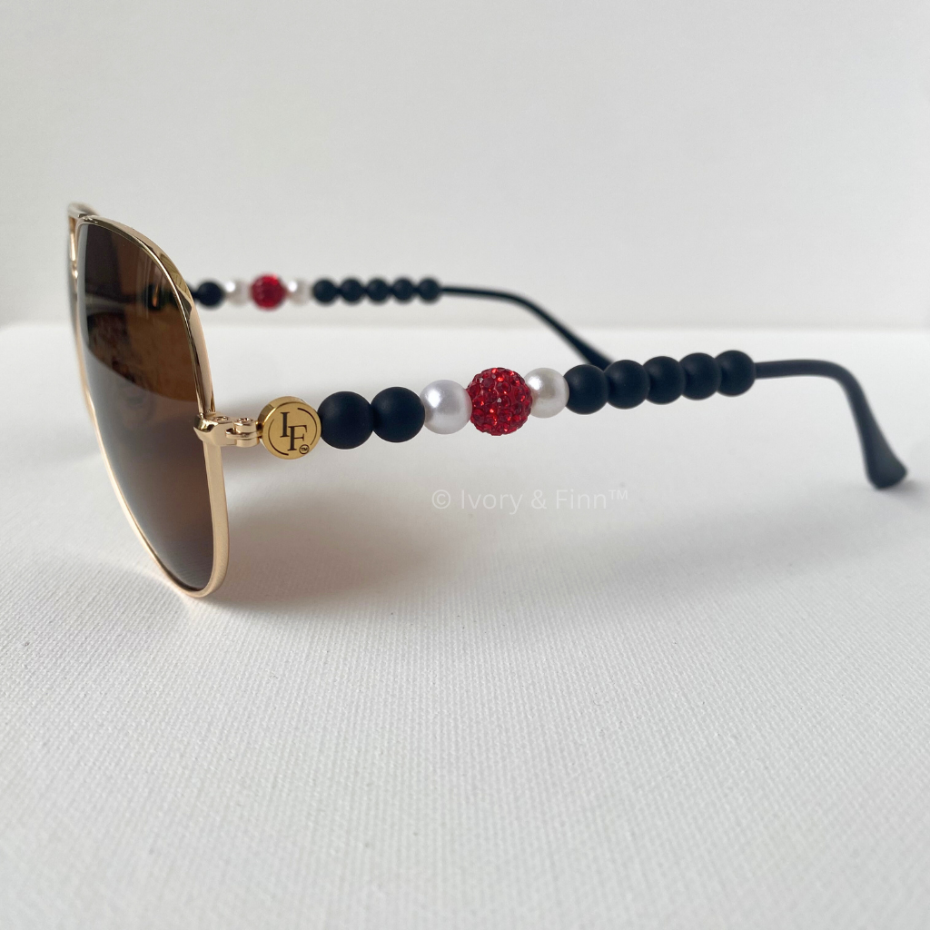Black beaded sunglasses with red crystal accent and pearl details by Ivory & Finn™ – Black Ice Radiance style