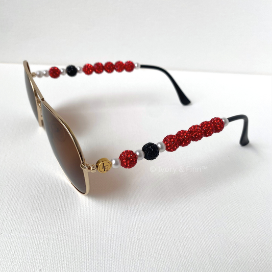 Custom red and black beaded sunglasses with pearl accents by Ivory & Finn™ – Crimson Spark style, jewelry-inspired eyewear