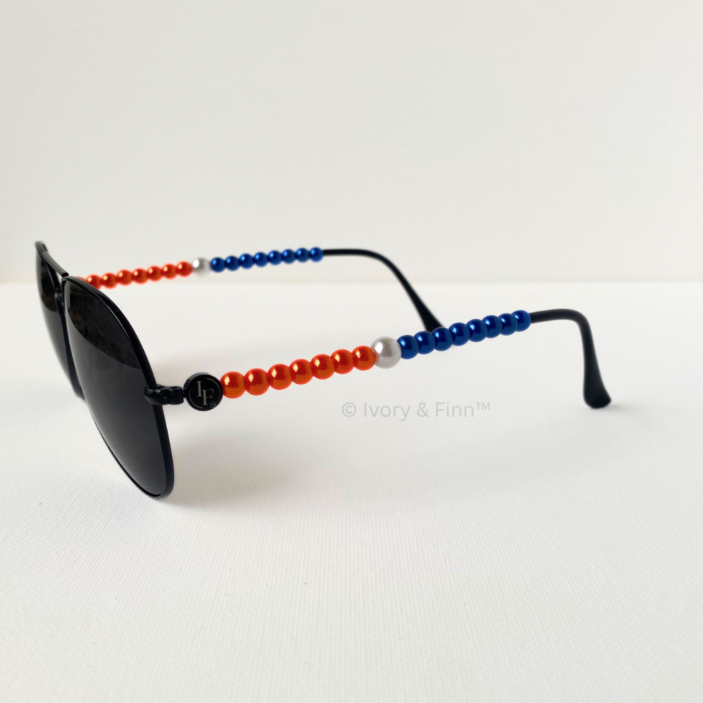 Orange and blue beaded sunglasses with silver accent beads on black aviator frames by Ivory & Finn™ – Electric Rivalry style